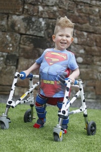 Models Direct's Noah in his superman costume